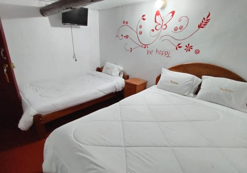 Postel nebo postele na pokoji v ubytování Ccapaq Wasi