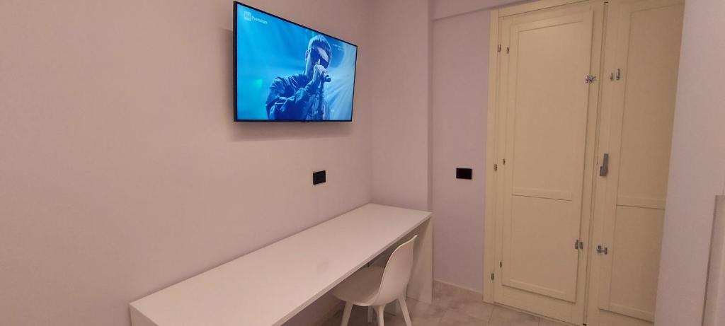 TV a/nebo společenská místnost v ubytování Lungofiume Suite