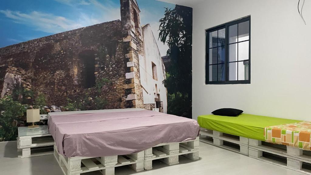 Postel nebo postele na pokoji v ubytování Palmira House