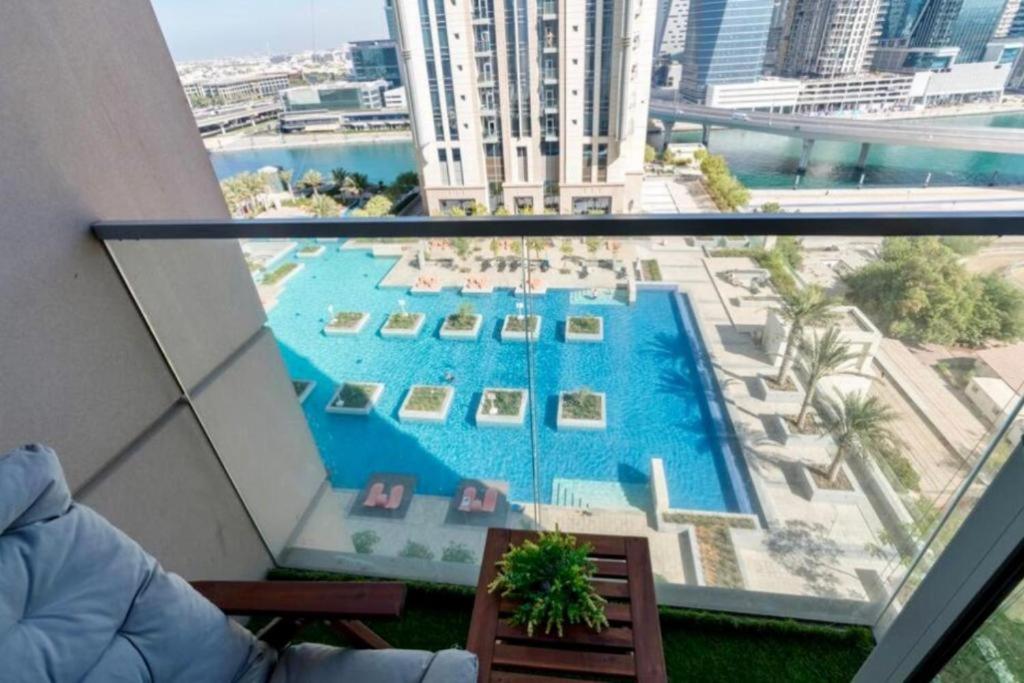 a view of a swimming pool from a building at Apartament Great view Dubai in Dubai