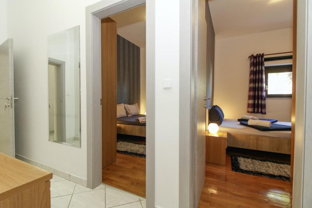 Postel nebo postele na pokoji v ubytování Aida in Poreč * Istrien