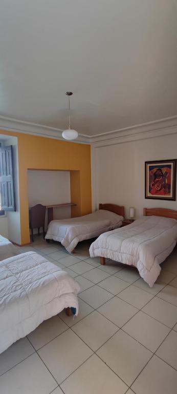 Postel nebo postele na pokoji v ubytování Flying Dog Hostel Arequipa