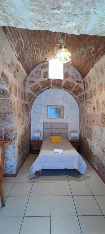 Postel nebo postele na pokoji v ubytování Flying Dog Hostel Arequipa