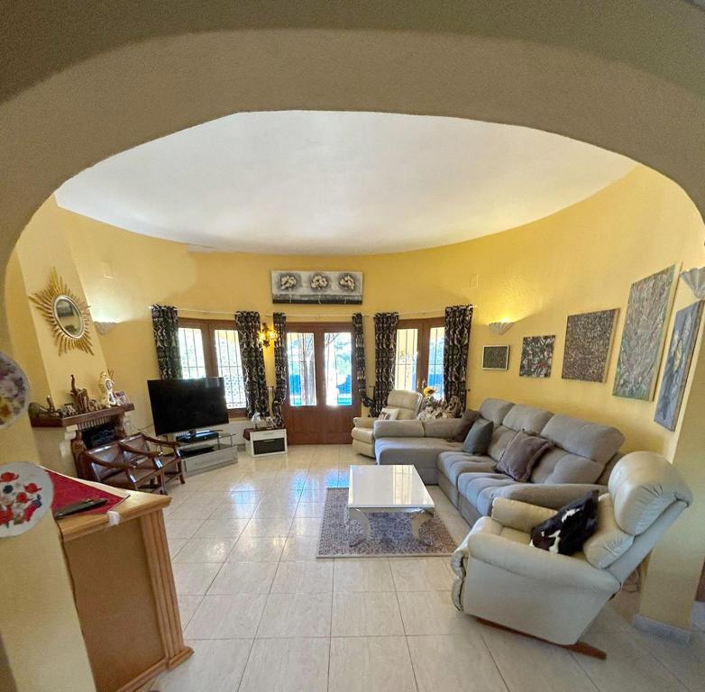 a large living room with couches and a tv at Sweet Home in Pego