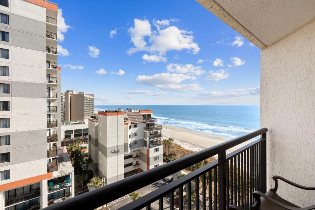a balcony with a view of the beach and buildings at Ocean Reef 925 in Myrtle Beach