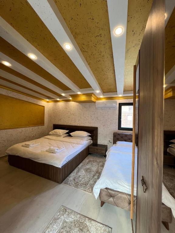 Postel nebo postele na pokoji v ubytování Hotel Premium