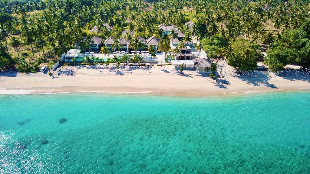 an aerial view of a resort on a beach at Seven Secrets by Hanging Gardens in Senggigi 