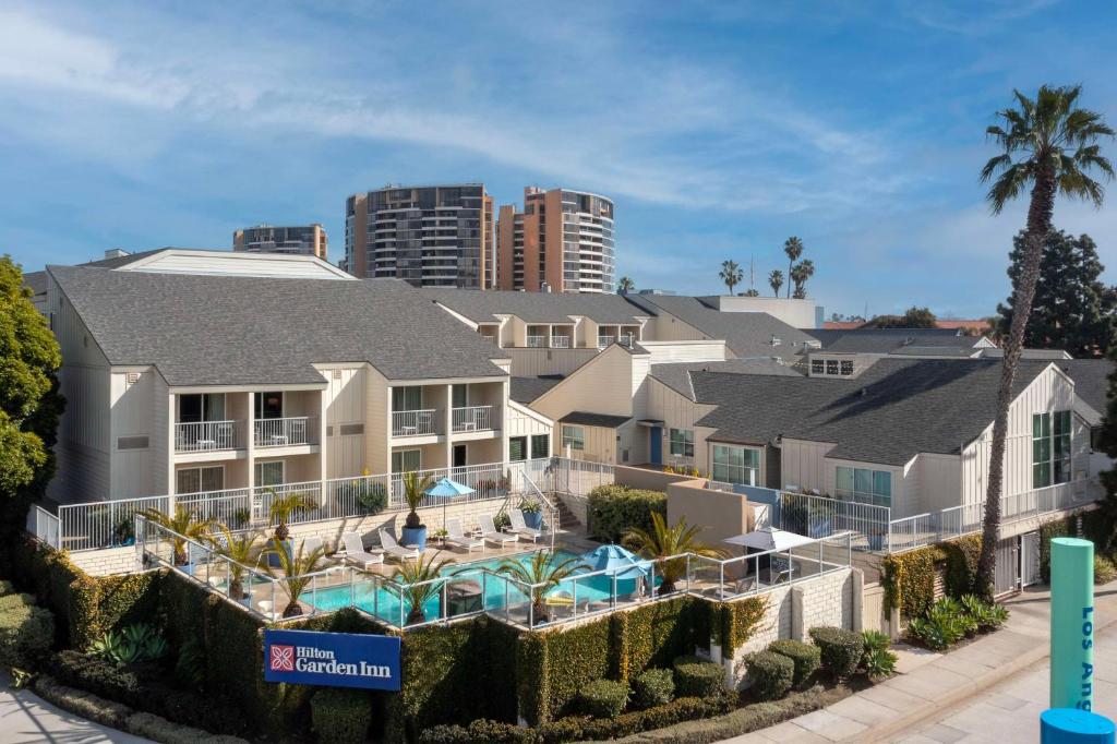 aominium building with a swimming pool and a resort at Hilton Garden Inn Los Angeles Marina Del Rey in Los Angeles