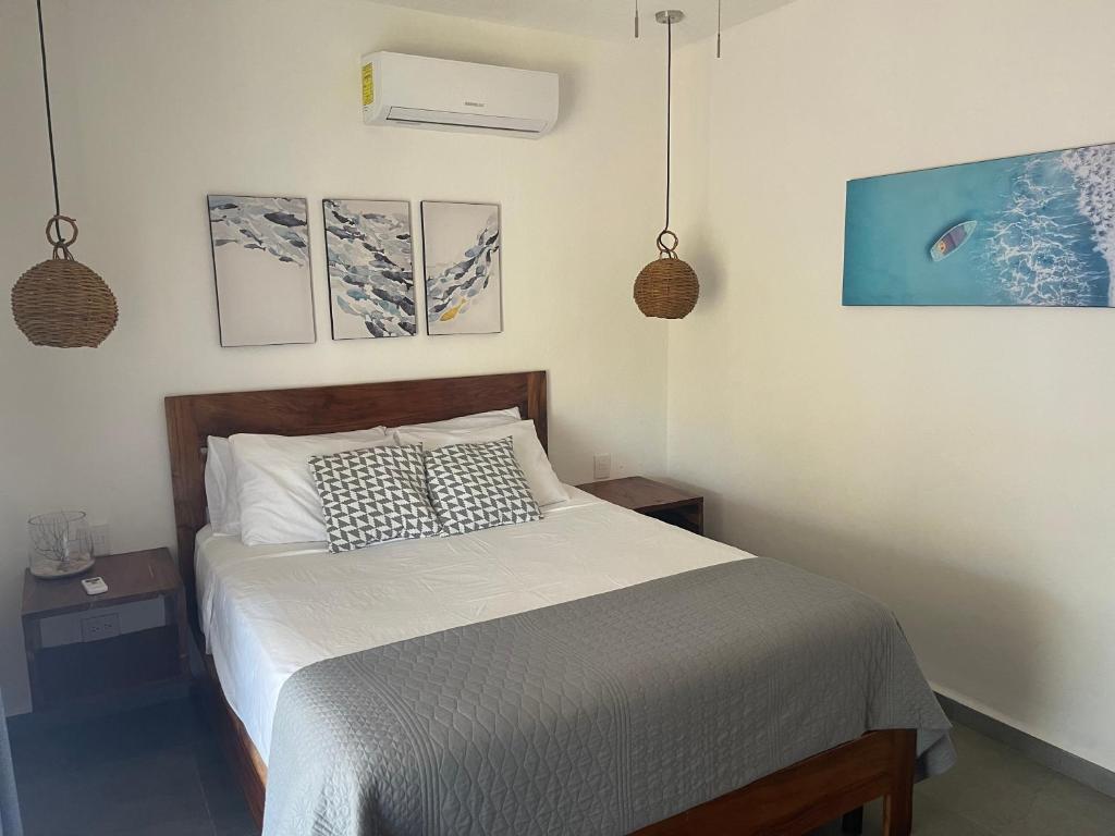 Postel nebo postele na pokoji v ubytování Casa OM