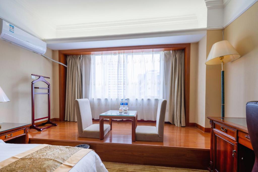 Postel nebo postele na pokoji v ubytování Sunshine Holiday Hotel Fuzhou