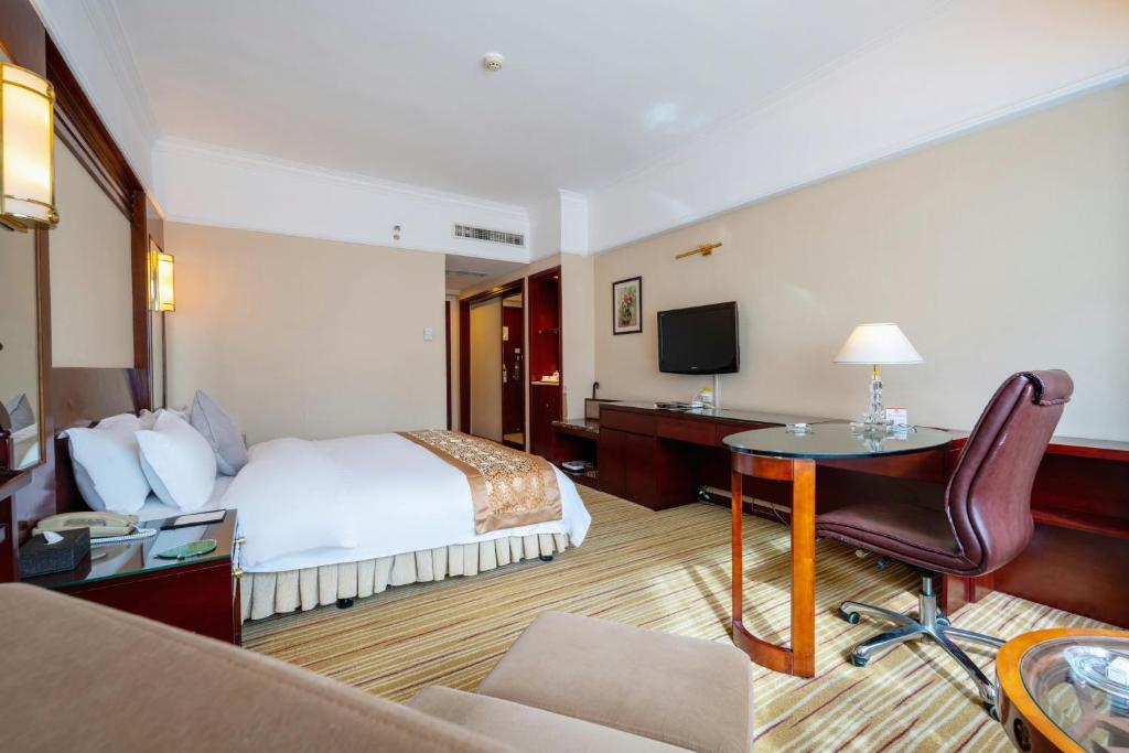 Postel nebo postele na pokoji v ubytování Sunshine Holiday Hotel Fuzhou