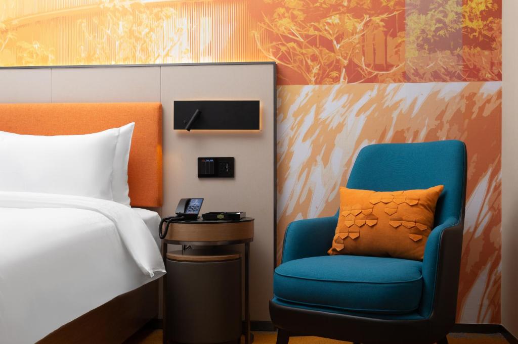 Postel nebo postele na pokoji v ubytování Hampton by Hilton Foshan Shunde Beijiao