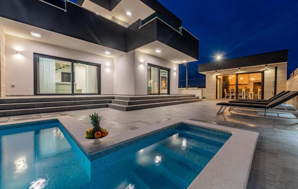 a swimming pool in the middle of a house at Cdi706 in Murvica
