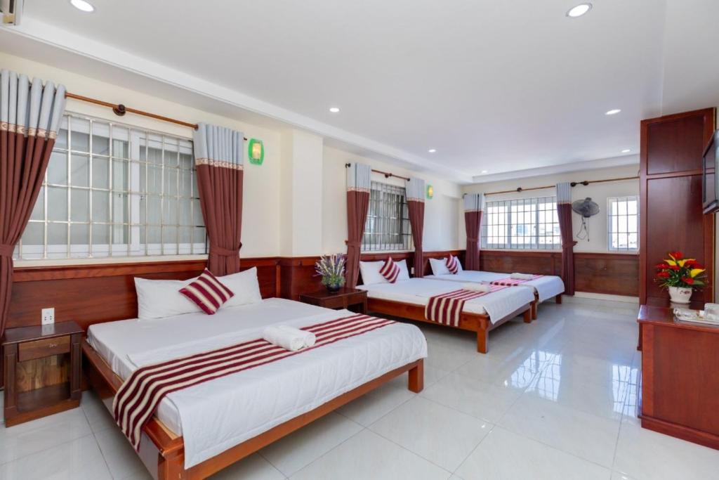 Postel nebo postele na pokoji v ubytování ĐẠI AN Hotel