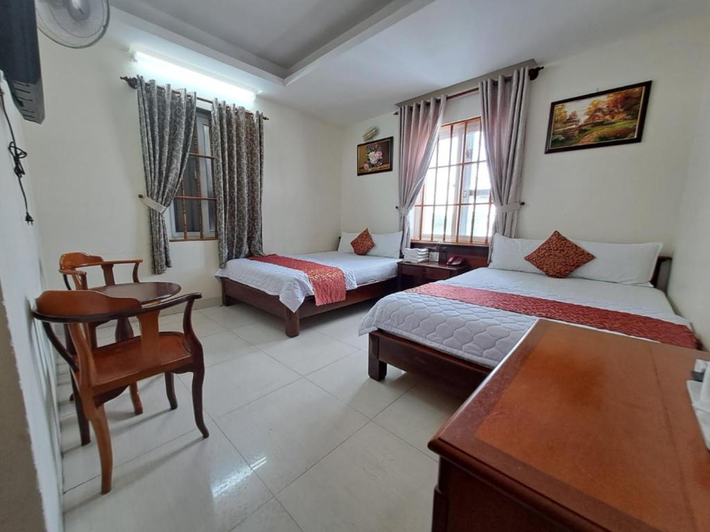 Postel nebo postele na pokoji v ubytování ĐẠI AN Hotel