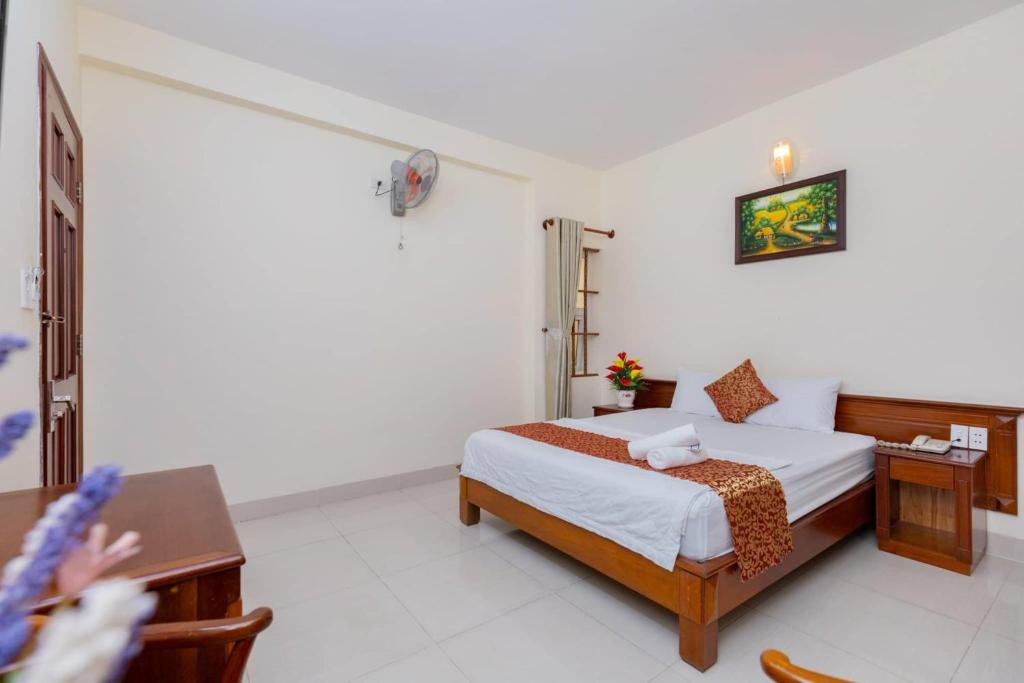 Postel nebo postele na pokoji v ubytování ĐẠI AN Hotel