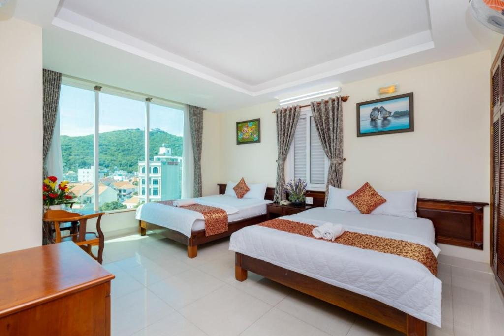 Postel nebo postele na pokoji v ubytování ĐẠI AN Hotel