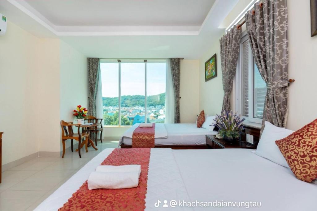 Postel nebo postele na pokoji v ubytování ĐẠI AN Hotel