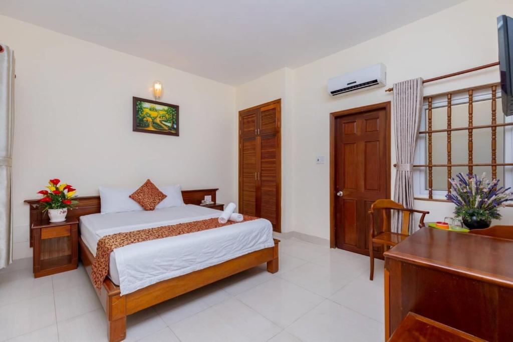 Postel nebo postele na pokoji v ubytování ĐẠI AN Hotel