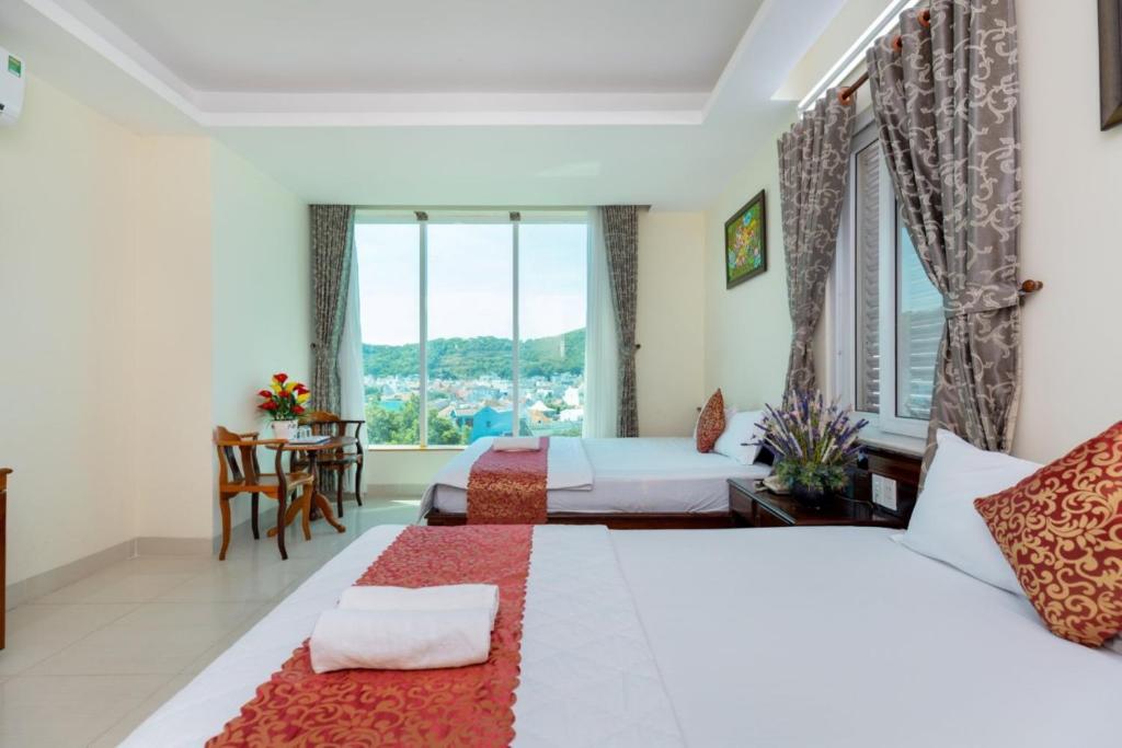 Postel nebo postele na pokoji v ubytování ĐẠI AN Hotel