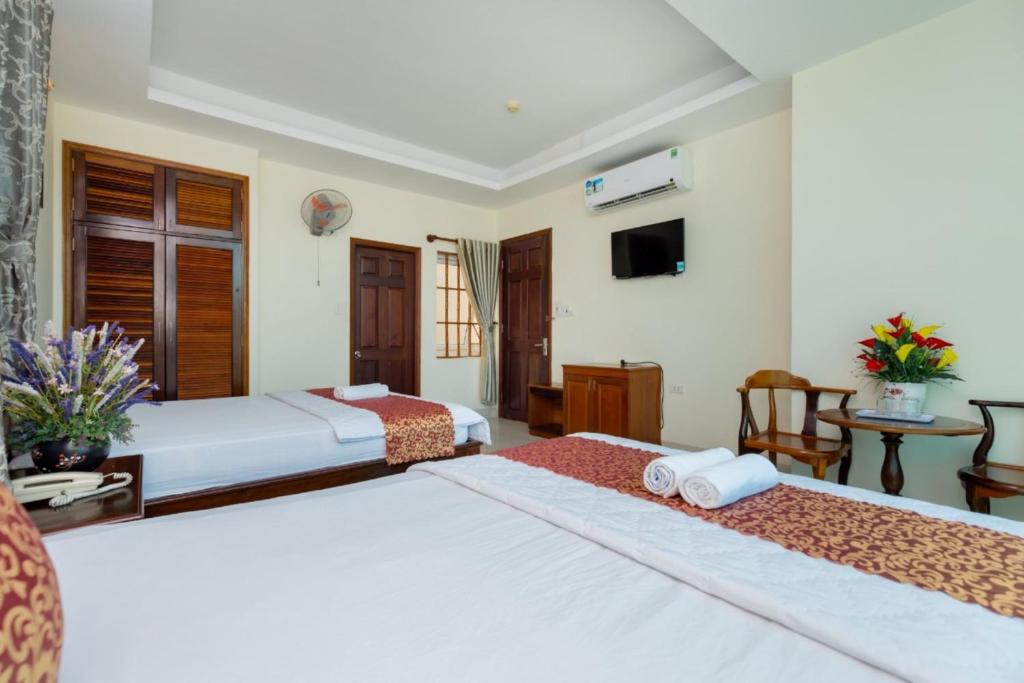 Postel nebo postele na pokoji v ubytování ĐẠI AN Hotel