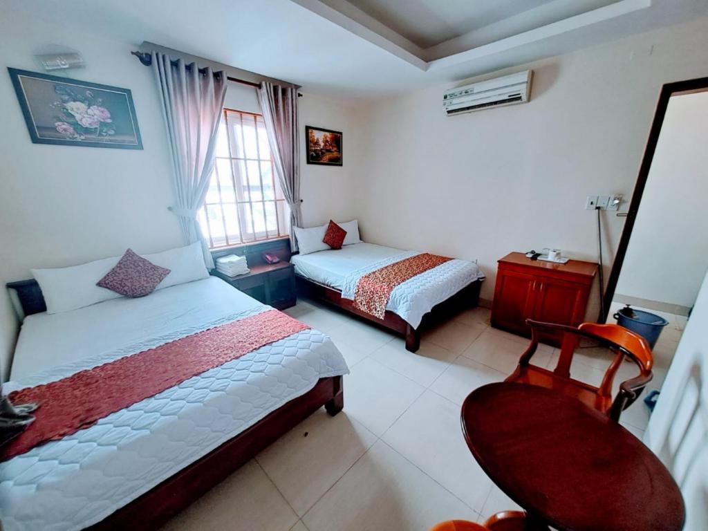Postel nebo postele na pokoji v ubytování ĐẠI AN Hotel