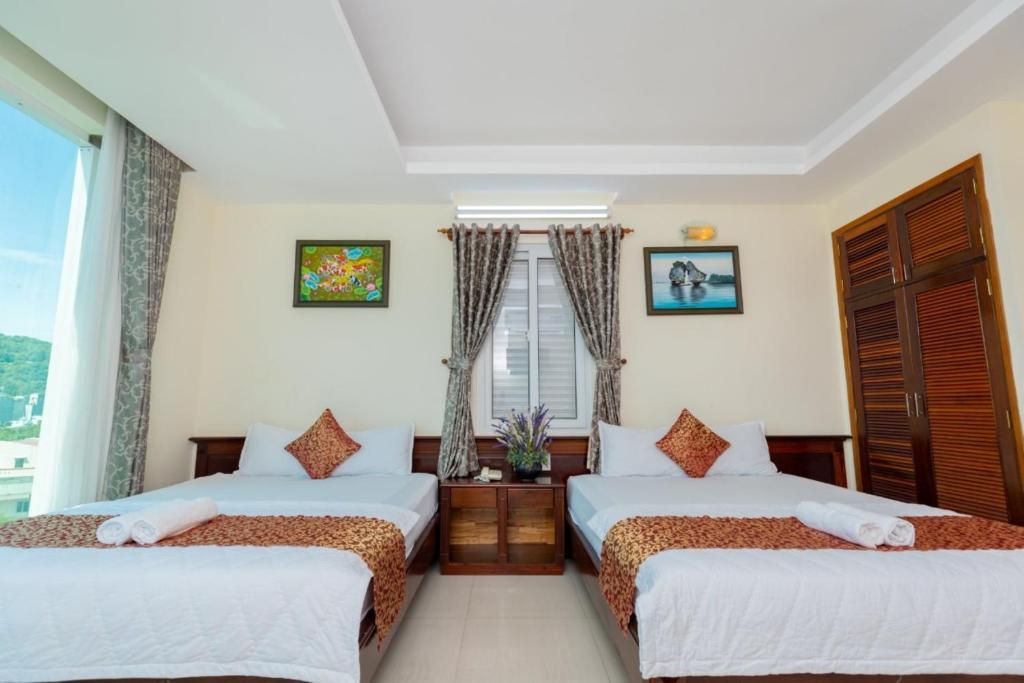Postel nebo postele na pokoji v ubytování ĐẠI AN Hotel