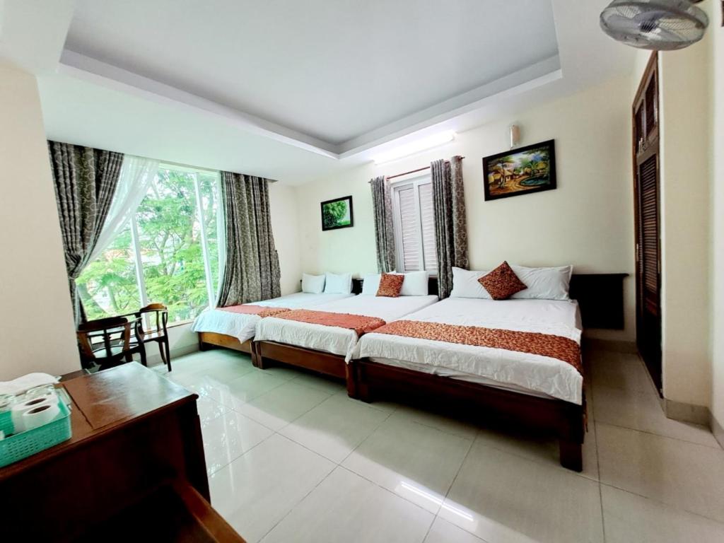 Postel nebo postele na pokoji v ubytování ĐẠI AN Hotel