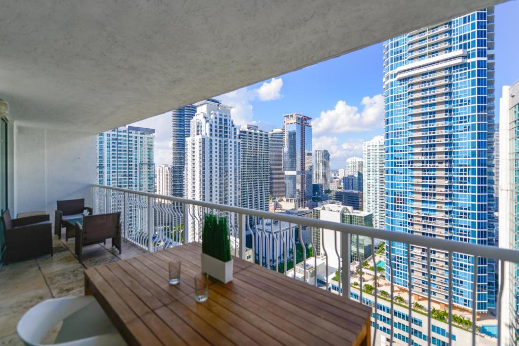 a balcony with a view of a city skyline at Centric Modern 40thFloor Brickell Condo FREE parking by Palermo Home Miami in Miami