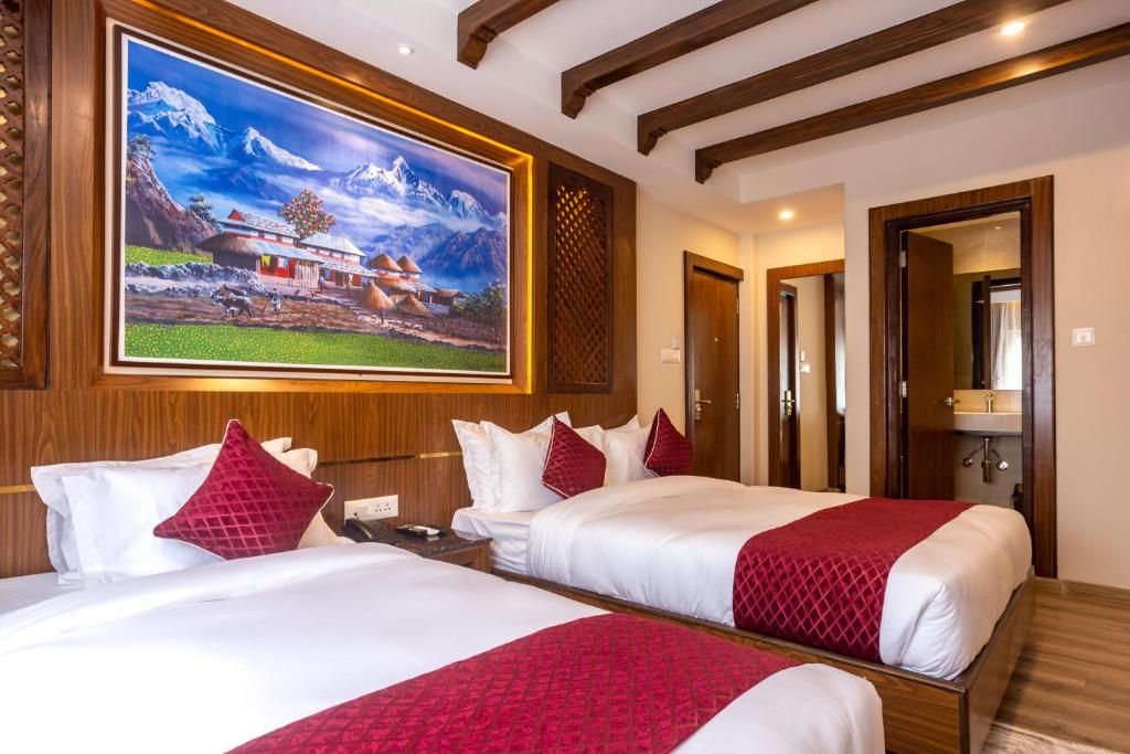 Postel nebo postele na pokoji v ubytování Kailash Boutique Hotel