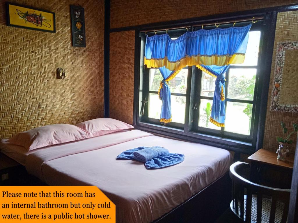 Postel nebo postele na pokoji v ubytování Yoschi's Hotel Bromo