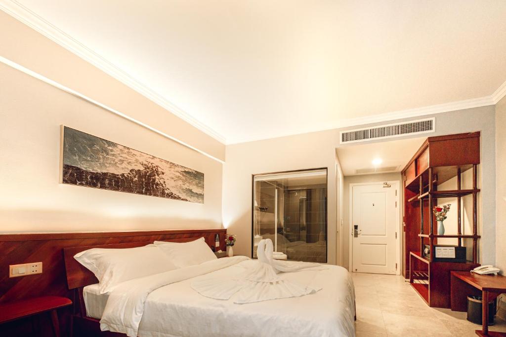 Postel nebo postele na pokoji v ubytování Solar Hotel