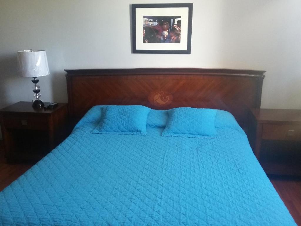 Postel nebo postele na pokoji v ubytování Hostal Tutamanda 2