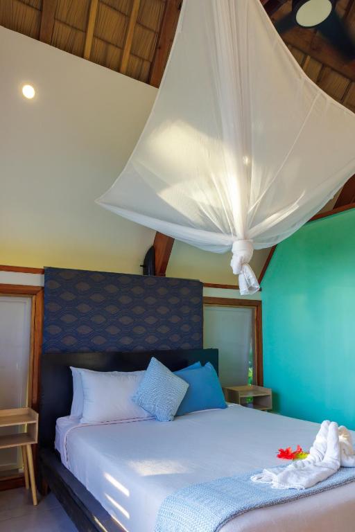 Postel nebo postele na pokoji v ubytování Mango Bay Resort