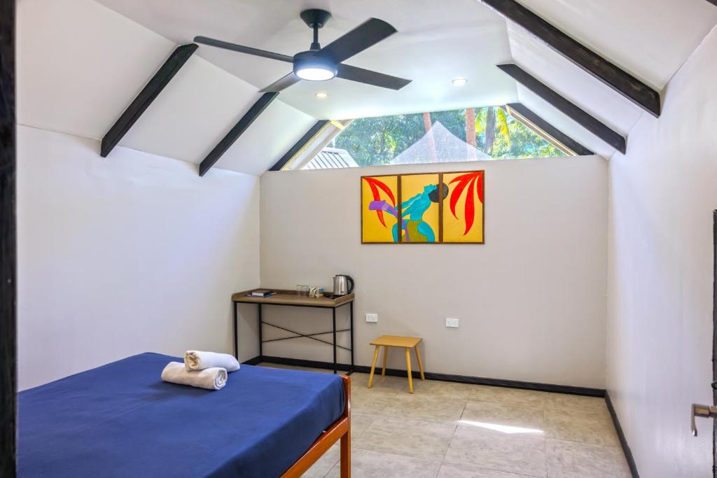 Postel nebo postele na pokoji v ubytování Mango Bay Resort