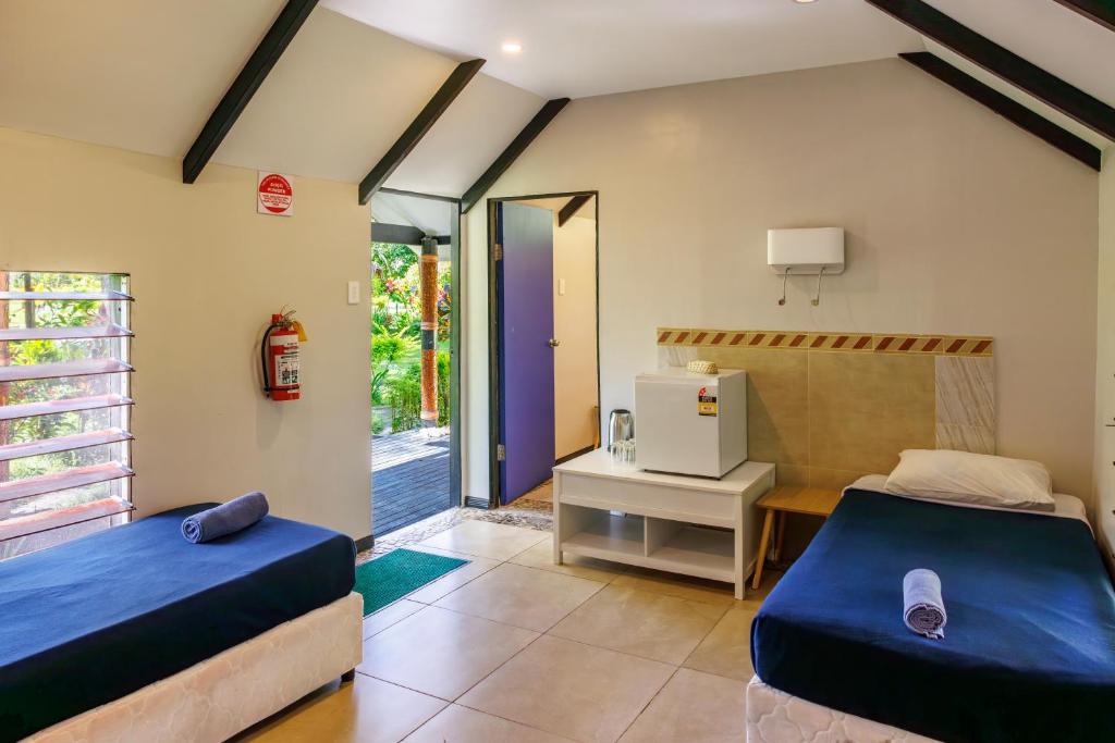 Postel nebo postele na pokoji v ubytování Mango Bay Resort