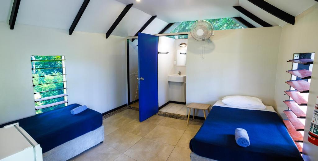 Postel nebo postele na pokoji v ubytování Mango Bay Resort