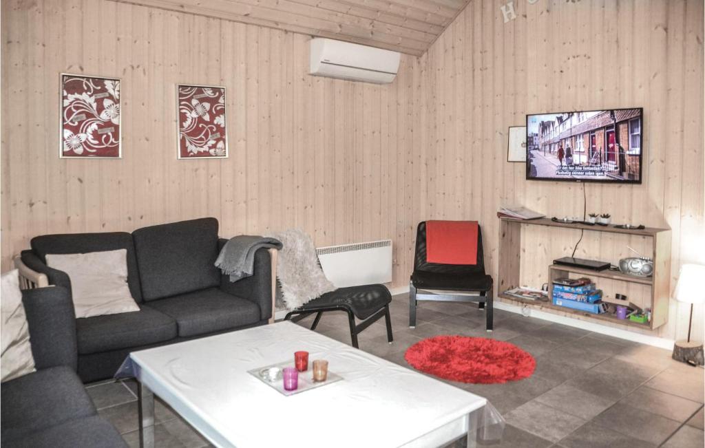 TV a/nebo společenská místnost v ubytování Hugoline