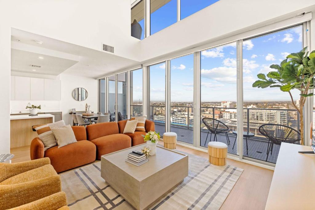 a living room with a couch and a table at @ Marbella Lane - Luxe 3BR Penthouse in Long Beach in Long Beach