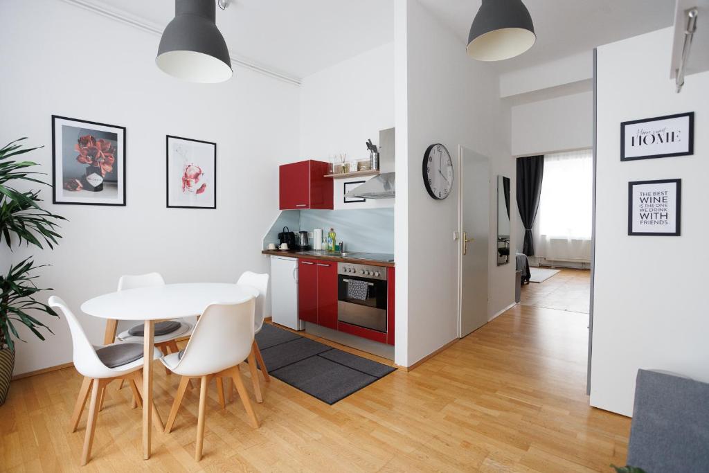 a kitchen and dining room with a table and chairs at #29 Heaven Messe/Prater in Vienna