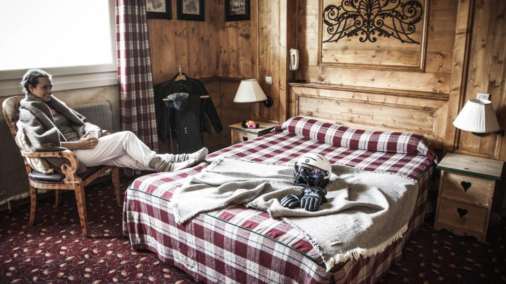 Postel nebo postele na pokoji v ubytování Hotel Altitude