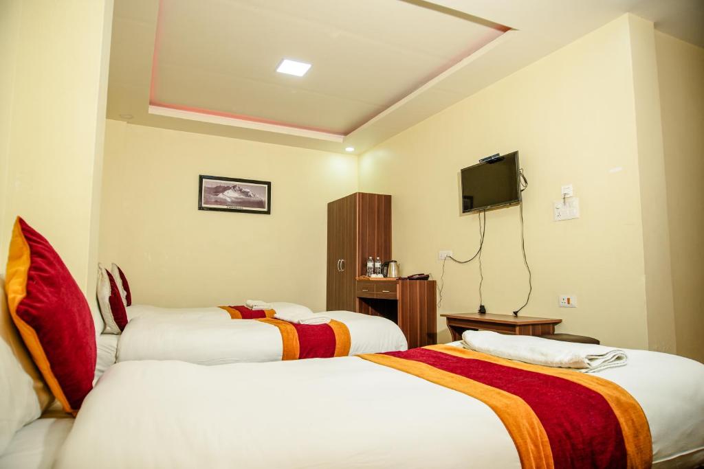 Postel nebo postele na pokoji v ubytování Hotel Edingo Inn