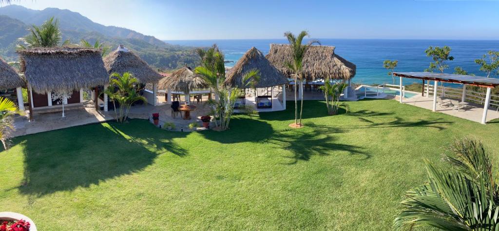 an aerial view of a resort with the ocean at asante sana - El Cielo in Chimo