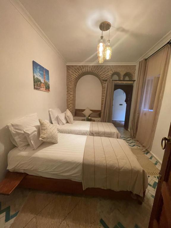 Postel nebo postele na pokoji v ubytování Riad Amalia