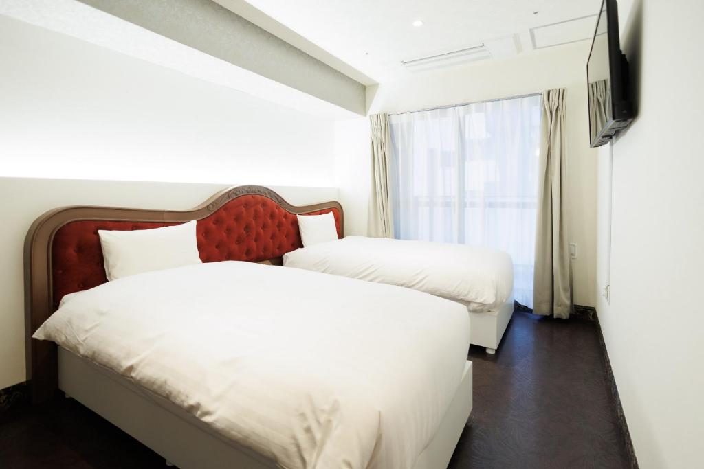 Hotaku HOTEL Akihabaraにあるベッド