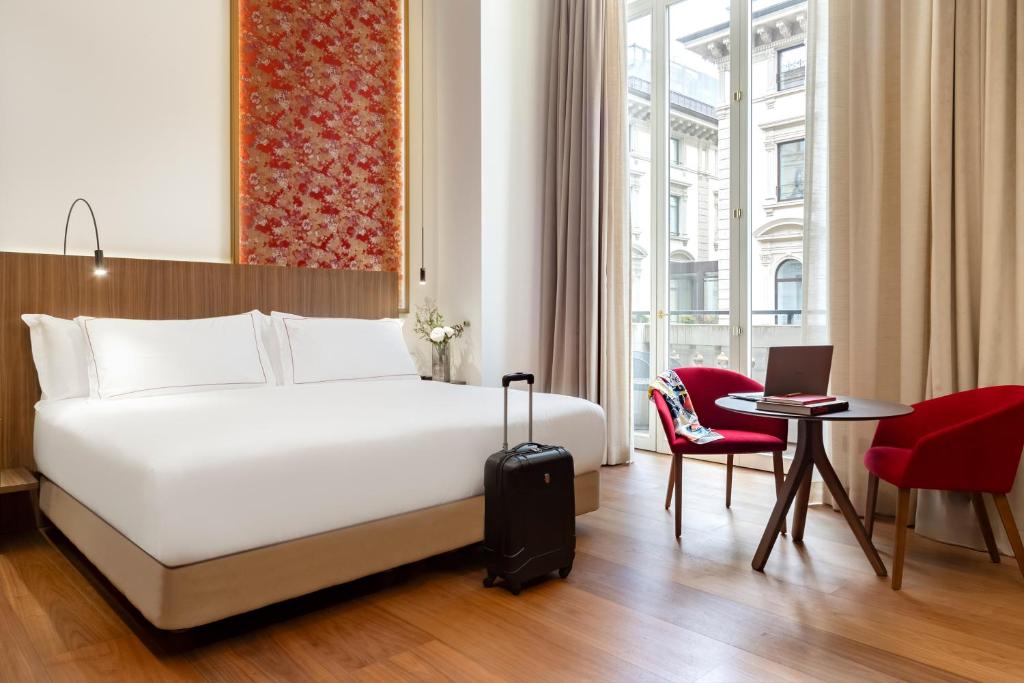 Postel nebo postele na pokoji v ubytování Palazzo Cordusio Gran Melia - The Leading Hotels of the World