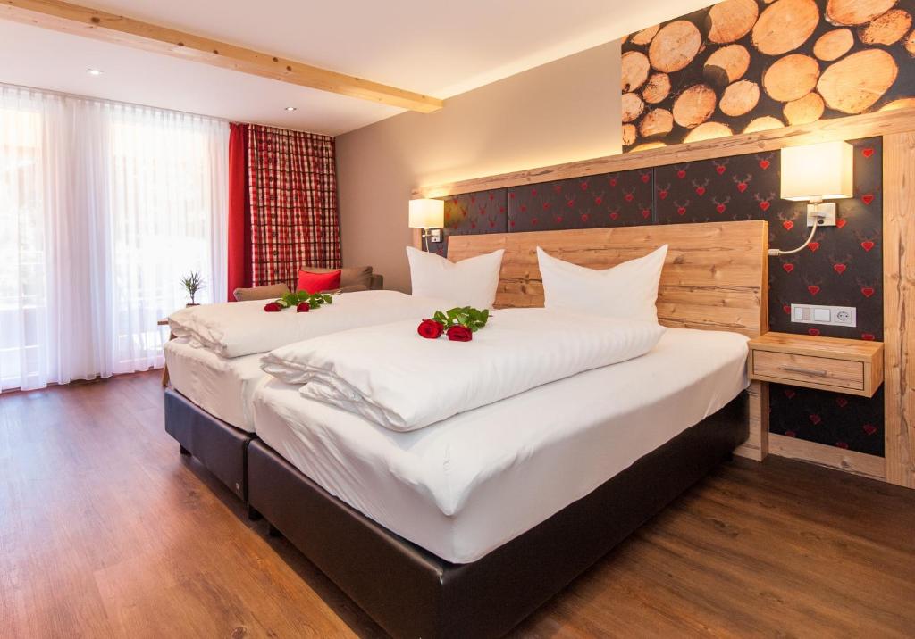 Postel nebo postele na pokoji v ubytování Albtalblick Ihr Wellness- & Wanderhotel