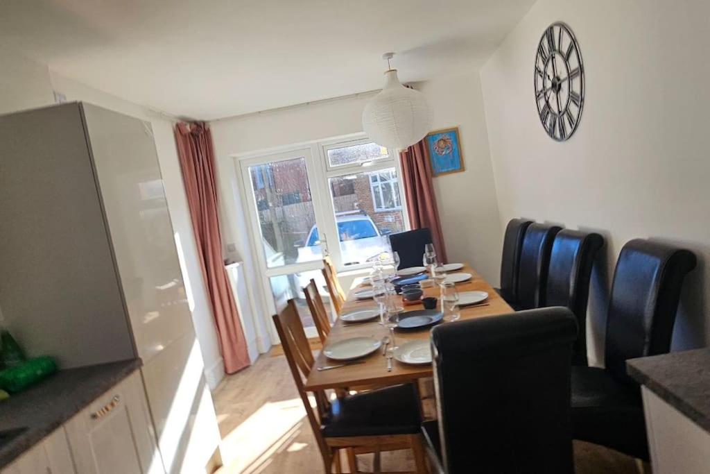 a dining room with a table with chairs and a dining room at Avocet View *sleeps 10* in Exmouth
