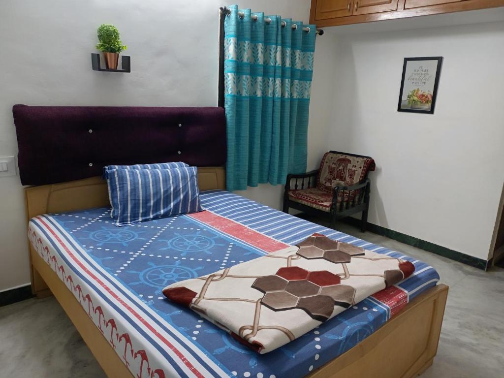 Postel nebo postele na pokoji v ubytování FriendlyStay at Madanandapuram