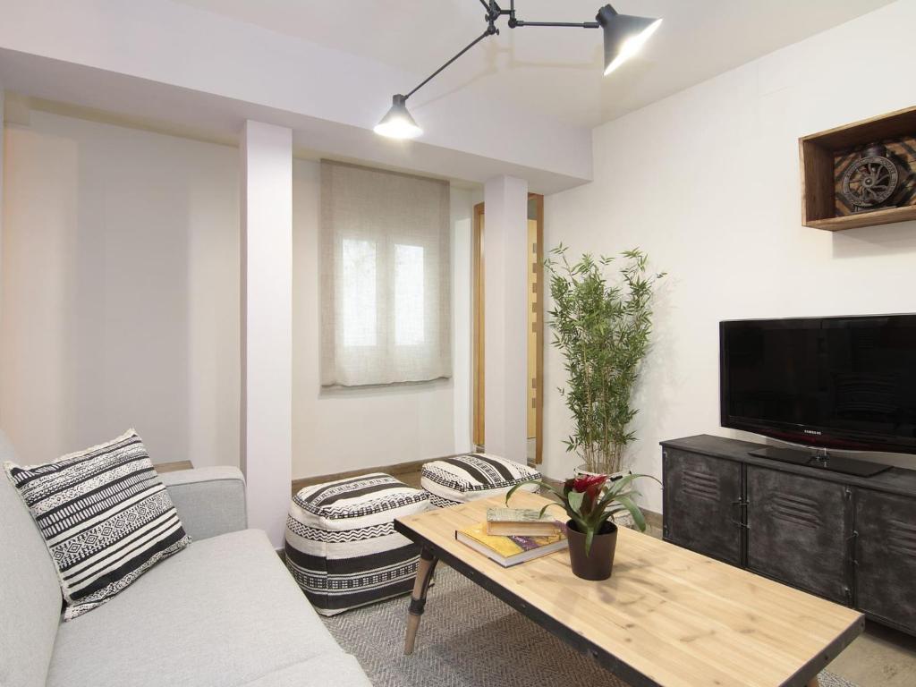 TV a/nebo společenská místnost v ubytování Chezmoihomes Apartment Cathedral 2 dormitorios